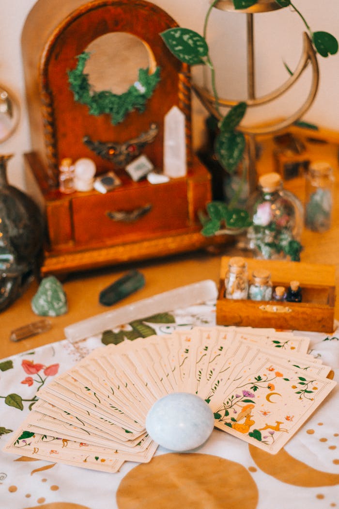 A warm, mystical tarot card layout adorned with crystals and vintage decor for a spiritual setting.
